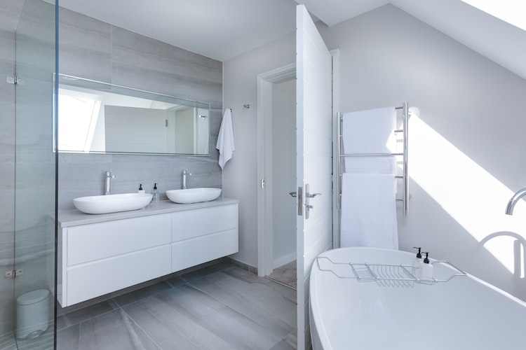Spacious bathroom with an entirely white interior