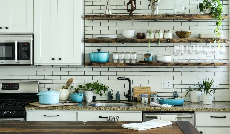 Brown wooden open shelves in a kitchen