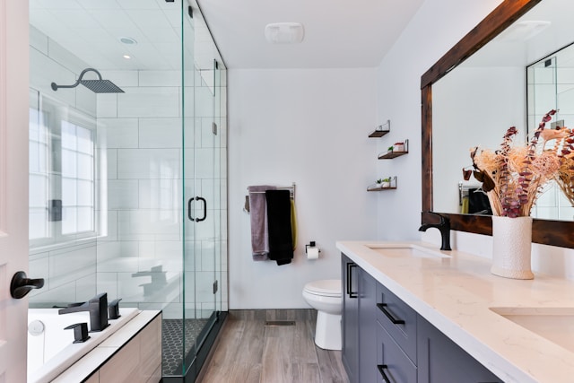 A modern bathroom with white tiles and a walk-in shower